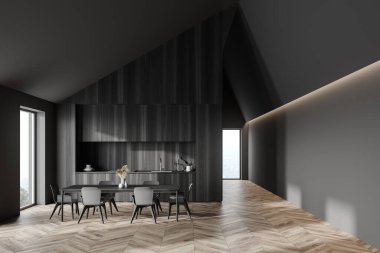 Gri ve koyu ahşap duvarları, ahşap tezgahları ve gri sandalyeli yemek masası olan şık tavan arası mutfağı. Bulanık dağ manzaralı pencereler. 3d oluşturma