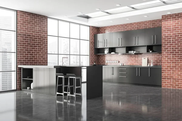 Corner of stylish kitchen with brick walls, concrete floor, gray cupboards and countertops, bar with stools and window with blurry cityscape. 3d rendering