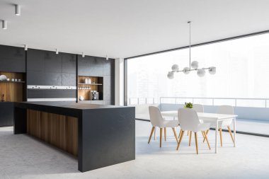 Siyah ve ahşap duvarlı şık mutfak köşesi, fayanslı zemin, rahat tezgahlar, tabureli bar sandalyeli beyaz yemek masası ve bulanık şehir manzaralı balkon. 3d oluşturma