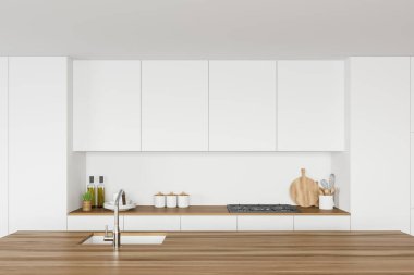 Lavaboda inşa edilmiş rahat ahşap bir ada modern mutfakta beyaz duvarları, beyaz tezgahları ve dolapları var. 3d oluşturma