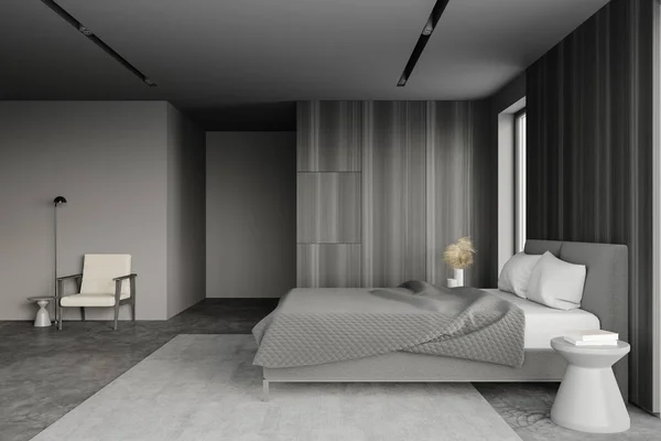 グレーと木製の壁 コンクリートの床 白い枕と居心地の良い白いアームチェア付き快適なキングサイズベッド付きのスタイリッシュなマスターベッドルームのサイドビュー 3Dレンダリング — ストック写真