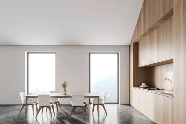 Boční Pohled Moderní Podkrovní Kuchyň Bílými Dřevěnými Stěnami Betonovou Podlahou — Stock fotografie
