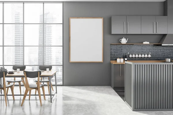 Interior of modern kitchen with gray walls, concrete floor, gray and wooden island and dining table with gray chairs standing near window with blurry cityscape. Vertical mock up poster. 3d rendering