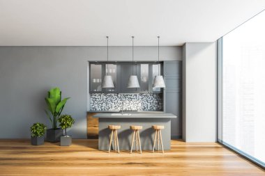 Gri ve fayanslı duvarları, ahşap zemini, ahşap tezgahları, gri dolapları ve tabureli barları olan şık panoramik mutfağın içi. Bulanık şehir manzaralı bir pencere. 3d oluşturma