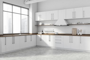 Modern mutfağın köşesinde beyaz tuğla duvarlar, beton zemin, beyaz ve ahşap dolaplar ve lavabo ve fırında yapılmış tezgahlar. Bulanık şehir manzaralı bir pencere. 3d oluşturma