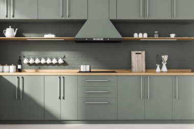 Gri tuğladan duvarları, ahşap zemini, gri ve ahşap dolapları ve lavabo ve ocakta yapılmış tezgahları olan şık bir mutfak. 3d oluşturma