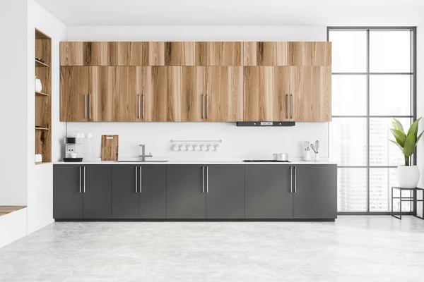 Kitchen with white stone countertops, solid wood cabinets, and vintage tile  on the walls Stock Photo - Alamy