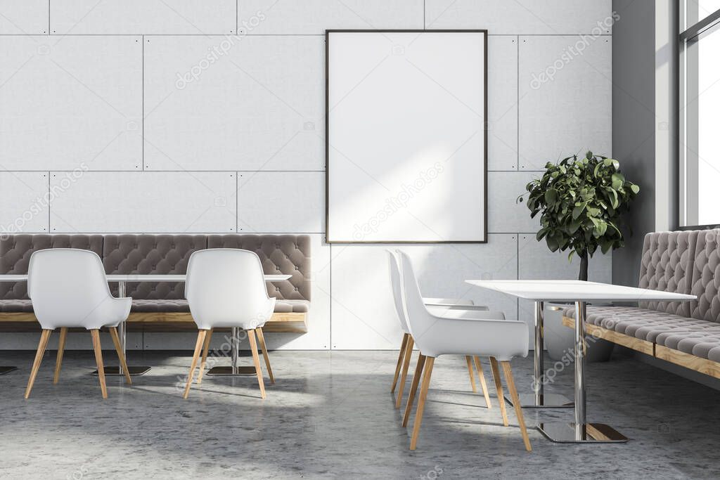 Interior of stylish coffee shop with white and gray walls, concrete floor, long white tables with chairs and cozy brown sofas. Window with blurry cityscape and vertical mock up poster. 3d rendering