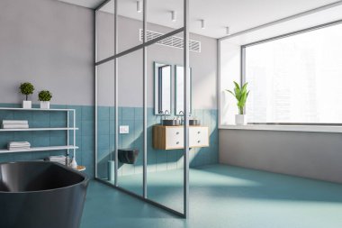 Mavi fayanslı ve gri duvarlı şık bir banyonun köşesi, rahat bir küvet, iki aynalı ve tuvaletli iki lavabo. Bulanık şehir manzarası. 3d oluşturma