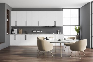 Gri tuğlalı duvarları, ahşap zemini, beyaz dolapları ve dolapları olan şık bir mutfak. Bej koltuklu yuvarlak yemek masası. 3d oluşturma