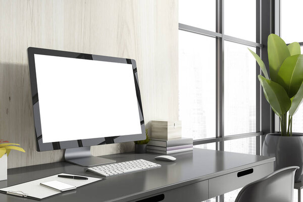 Modern computer with mock up screen standing on gray table in wooden room corner with blurry cityscape. Concept of advertising. 3d rendering