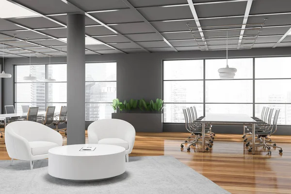 Interior of panoramic meeting room with gray walls, wooden floor, two conference tables with metal chairs and white armchairs in lounge area. Blurry cityscape. 3d rendering