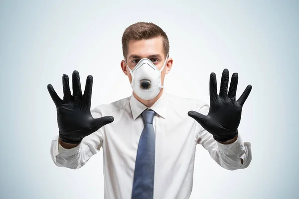 Serious Young Businessman Gloves Protective Mask Showing Stop Sign Blue — Stock Photo, Image