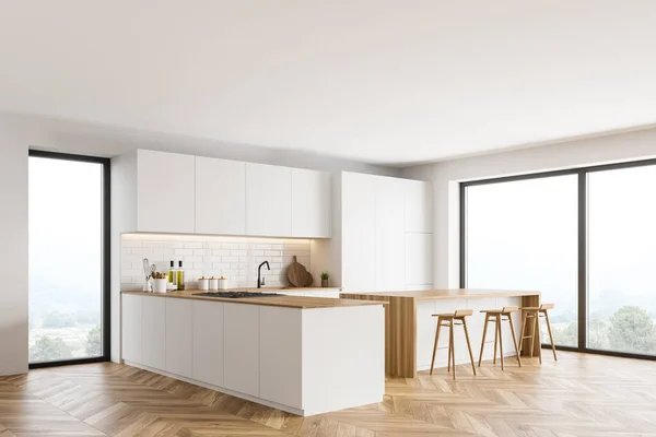 Corner of modern kitchen with white and brick walls, wooden floor, white cupboards and bar with stools. 3d rendering