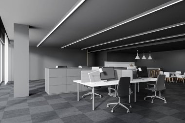 Gri duvarları ve halılı zemini olan modern açık uzay ofis köşelerinde duran bilgisayar tabloları. 3d oluşturma