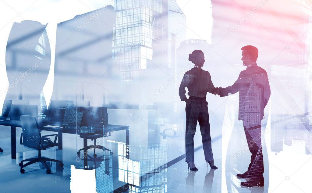 Silhouettes of businessman and businesswoman shaking hands in blurry modern office with double exposure of cityscape. Toned image