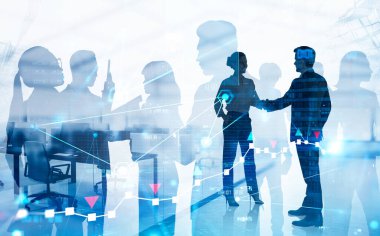 İş kadını ve iş kadınının siluetleri bulanık ofiste mali tablolara ve iş adamlarına iki kez maruz kalarak tokalaşıyor. Tonu ayarlanmış resim