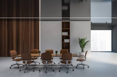 Beyaz ve koyu ahşap duvarları, uzun konferans masası ve kahverengi sandalyeleri olan şık bir toplantı odası. 3d oluşturma