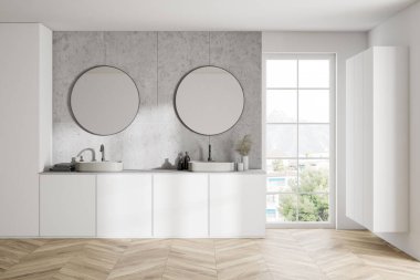 Modern banyo, beyaz ve fayanslı duvarlar, ahşap zemin ve iki yuvarlak aynalı çift lavabo. 3d oluşturma