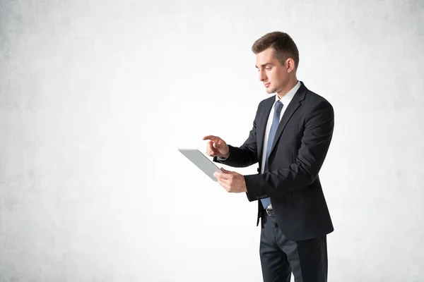 Portrait Serious Young European Businessman Using Tablet Computer Concrete Wall — Stock Photo, Image
