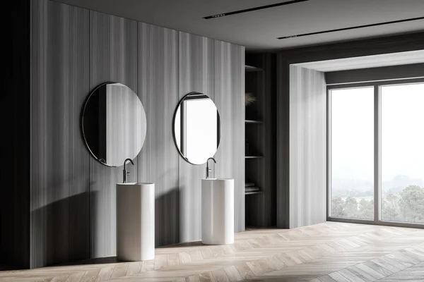 带有深色木墙 木制地板和双面水槽的时尚浴室角落 配有两个圆形镜子 3D渲染 — 图库照片