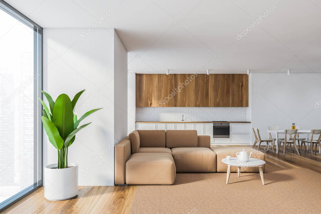 Interior of living room with white walls, wooden floor, beige sofa and kitchen in background. 3d rendering