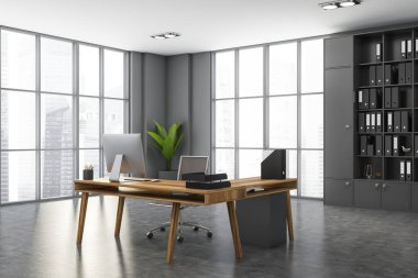Gri duvarları, beton zemini, bilgisayar masası ve klasörlü kitaplığı olan modern CEO ofisinin köşesi. 3d oluşturma
