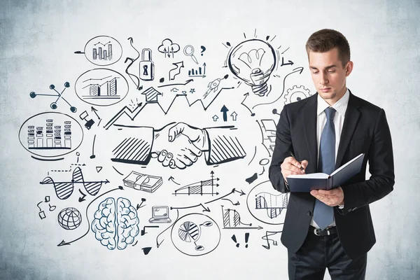 Serious Young Businessman Taking Notes Concrete Wall Creative Business Sketch — Stock Photo, Image