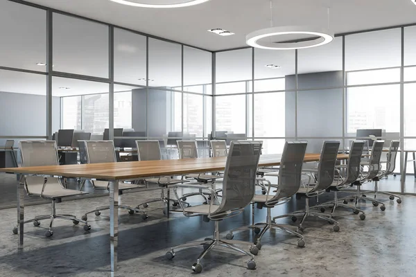 Gri duvarları, beton zemini ve uzun konferans masası olan şık toplantı odasının köşesi. 3d oluşturma