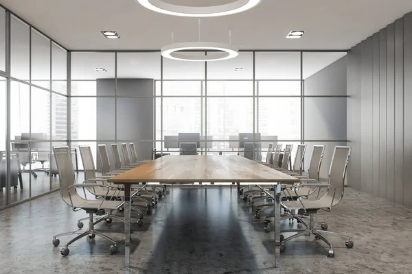 Gri duvarları, beton zemini ve uzun konferans masası olan şık toplantı odasının içi. 3d oluşturma