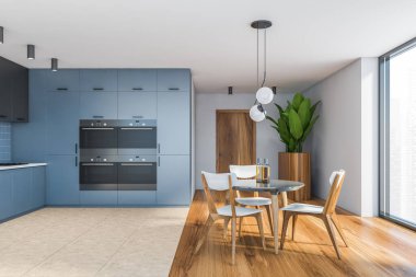 Beyaz ve mavi duvarlı şık mutfak manzarası, döşeme döşemesi, eşyaların içine monte edilmiş mavi dolaplar ve sandalyeli yuvarlak yemek masası. 3d oluşturma