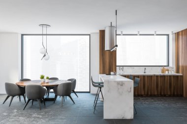 Gri ve ahşap duvarları, fayanslı zemini, bar ve gri sandalyeli yuvarlak yemek masası olan şık mutfağın yan görüntüsü. 3d oluşturma