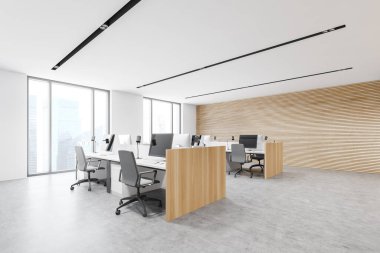 Beyaz ve ahşap duvarları, beton zemini ve sıra sıra bilgisayar masaları olan şık bir açık uzay ofis köşesinde rahat bir iş yeri. 3d oluşturma