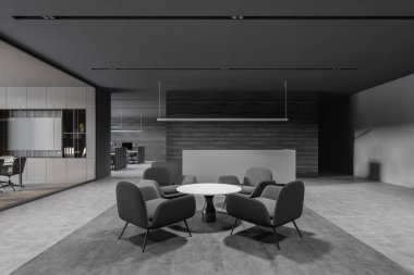 Gri ve ahşap duvarları, beton zemini, gri resepsiyon masası ve koltuklu yuvarlak kahve masası olan modern ofis bekleme odasının ön manzarası. 3d oluşturma