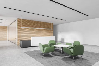 Beyaz ve ahşap duvarlı yeni ofis bekleme odasının köşesi, beton zemin, beyaz resepsiyon masası ve yeşil koltuklu yuvarlak kahve masası. 3d oluşturma