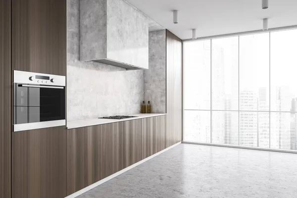 Corner of modern kitchen with white and dark wooden walls, concrete floor and dark wooden cupboards. 3d rendering