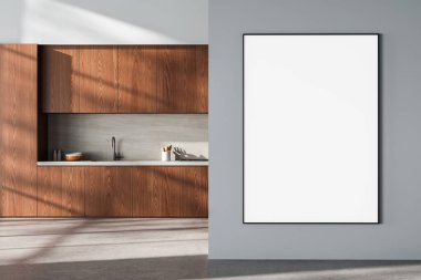 Ahşap dolaplı çağdaş mutfak ve gri duvarda büyük dikey poster modeli yumuşak gün ışığında minimalist iç mekan kavramı. 3B Hazırlama