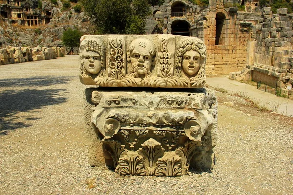 The facade of the Roman amphitheatre in Myra Ancient City is richly decorated with the theatrical masks and are scattered around because of the earthquake.