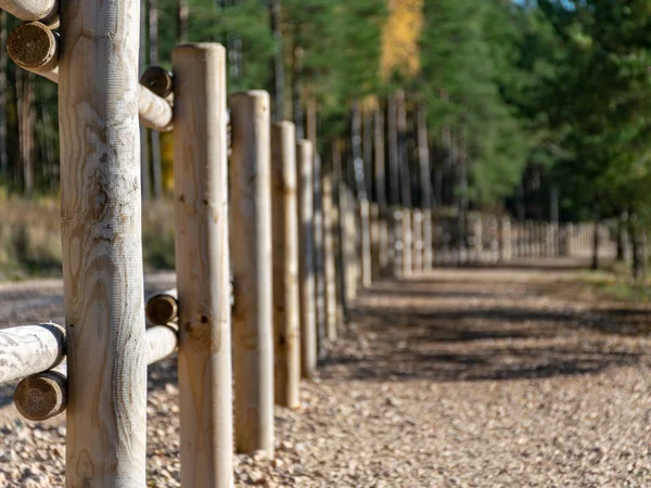 decorative wooden yard along the edge of the road