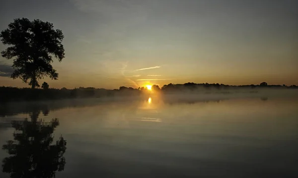 Foggy Blured Orange Sunrise River Burning Sky Reflected Calm Water — Stock Photo, Image