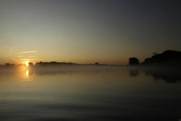 Foggy Blured Orange Sunrise River Burning Sky Reflected Calm Water — Stock Photo, Image
