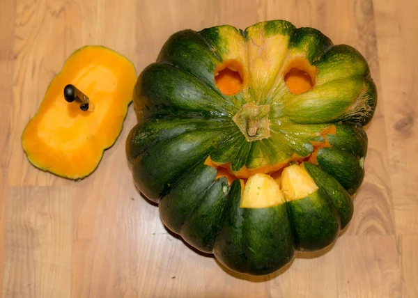 Preparing for Halloween, pumpkin carving, green carved pumpkin for Halloween, Halloween Jack o Lanterns, autumn