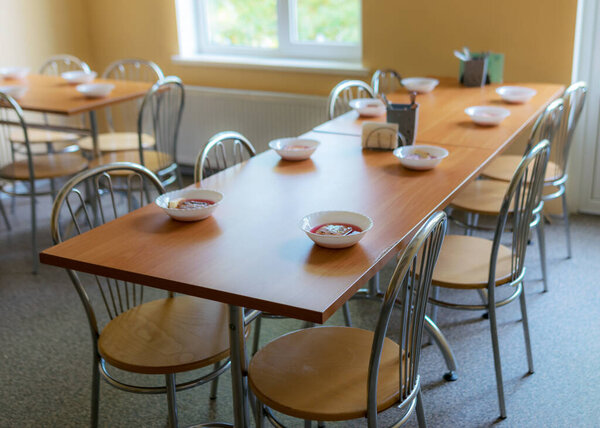 school kitchen canteen, set tables, canteen equipment, catering establishment, tables and chairs