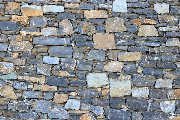 Grote grijze muur van stenen bakstenen — Stockfoto