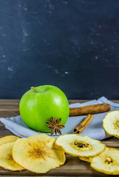 vegetarian apple chips with cinnamon and badyan on a brown background
