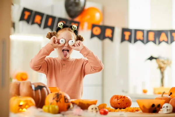 Portrait Girl Holding Spooky Eyes Front Face Showing Tongue While — Stock Photo, Image