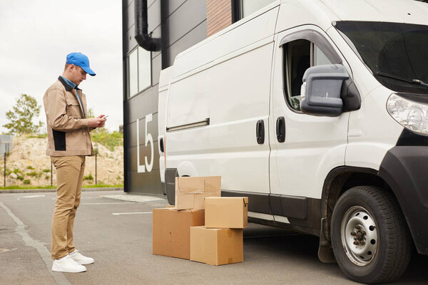 Man unloading parcels outdoors