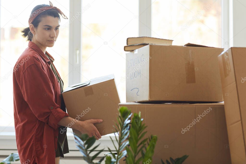 Woman carrying things in box