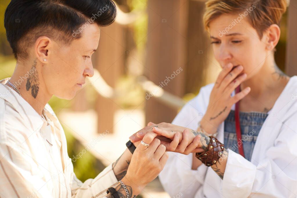 Lesbian proposal outdoors