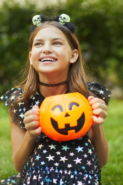 Child with pumpkin outdoors — Stock Photo, Image